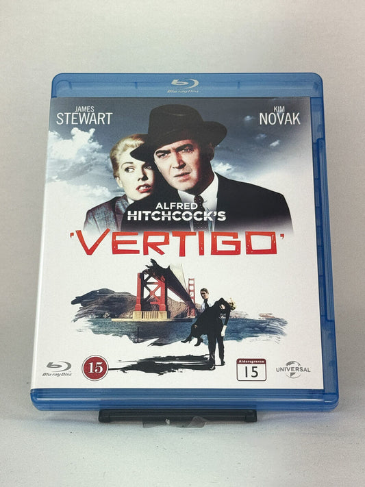 Forside av Blu-ray-cover til Vertigo – Alfred Hitchcocks psykologiske mesterverk med James Stewart og Kim Novak, brukt Blu-ray hos Brukbar Film.
